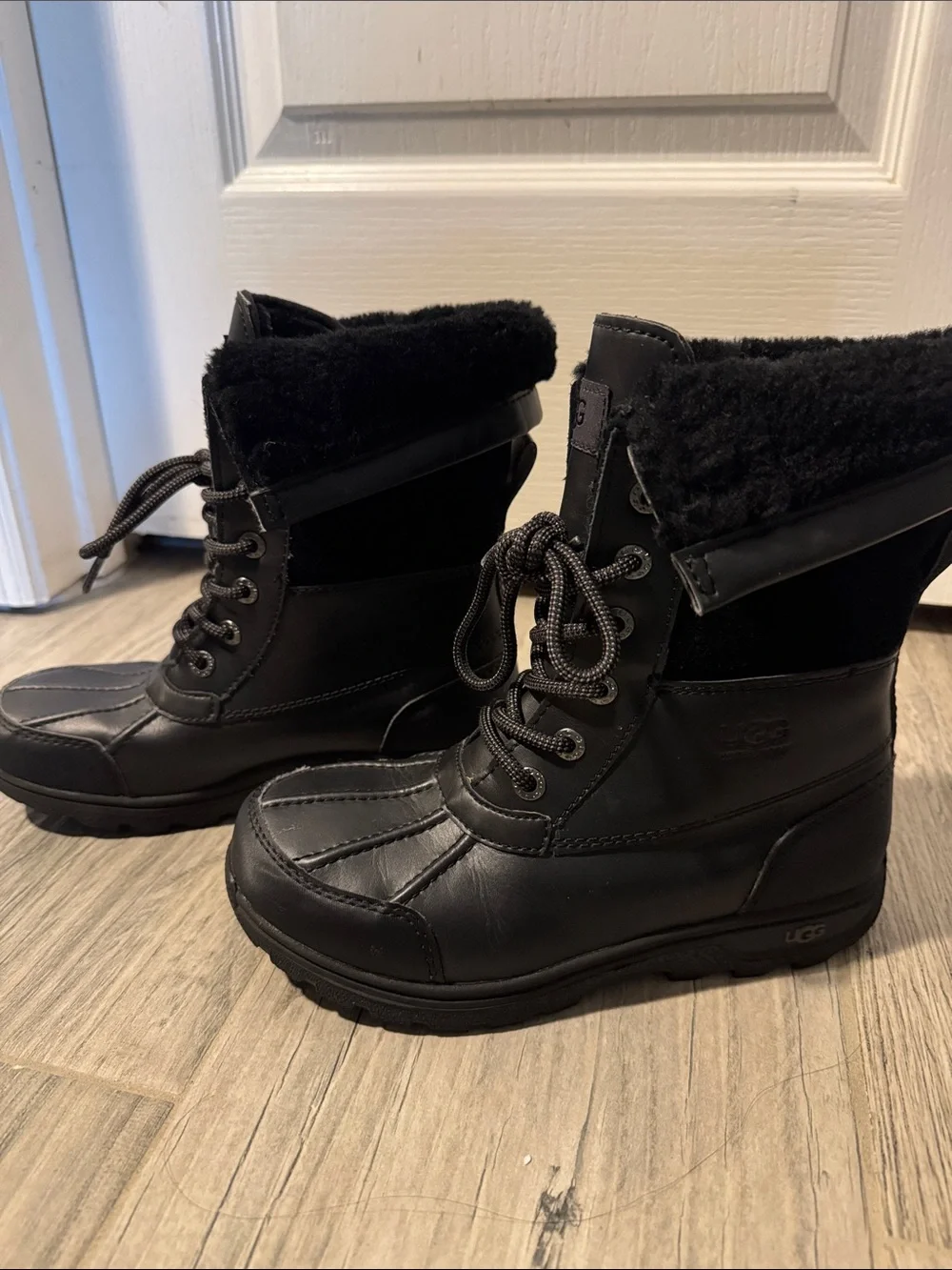 UGG Adirondack water proof insulated lace up winter boots.